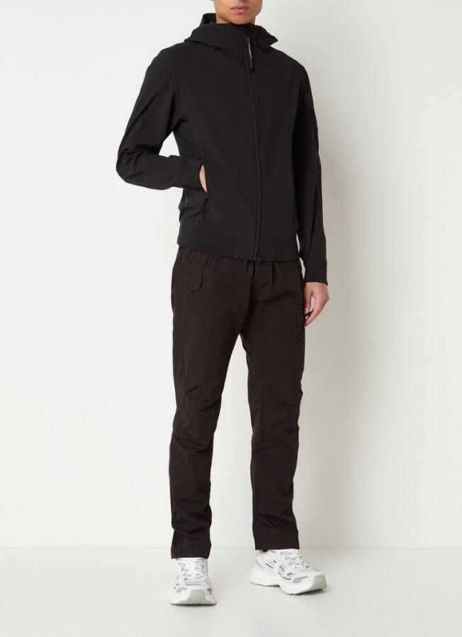 C.P. Company C P Company Softshell jack met ritszakken en capuchon